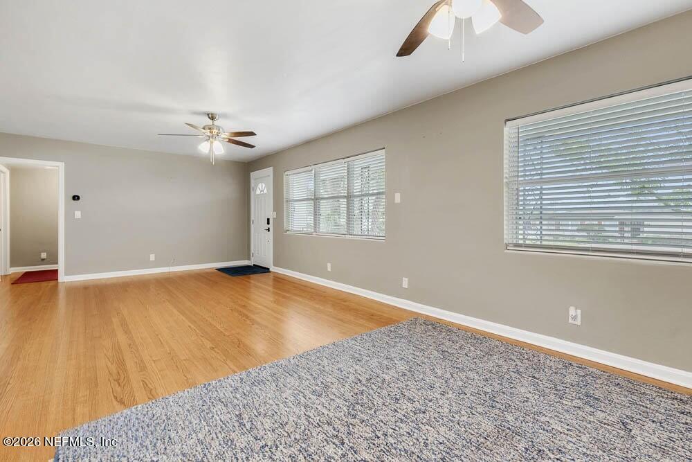773 Wren Road Jacksonville, FL 32216 - Photo 5 of 17 wooden floor in an empty room with a window