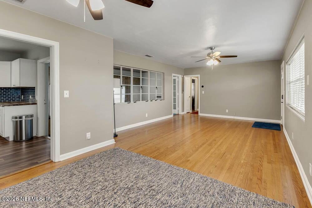 773 Wren Road Jacksonville, FL 32216 - Photo 6 of 17 wooden floor in an empty room with a window