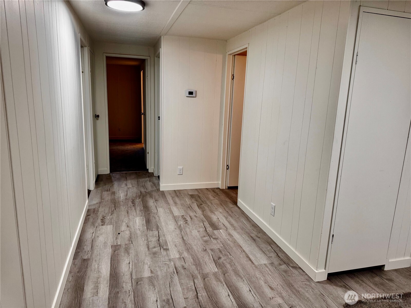 18425 Northeast 95th Street, Unit 76 Redmond, WA 98052 - Photo 12 of 20 a view of a room with wooden floor