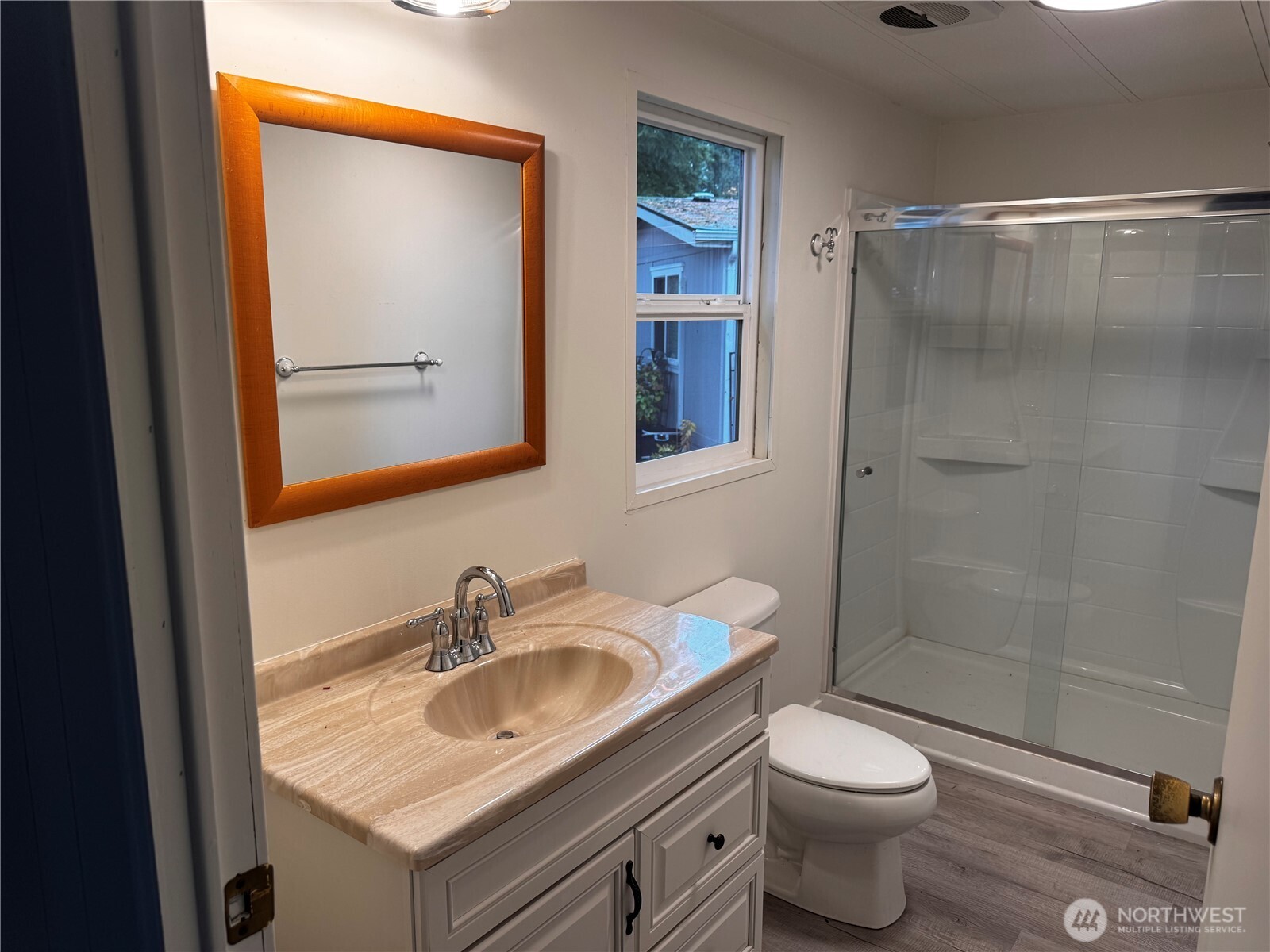 18425 Northeast 95th Street, Unit 76 Redmond, WA 98052 - Photo 14 of 20 a bathroom with a granite countertop sink toilet and shower