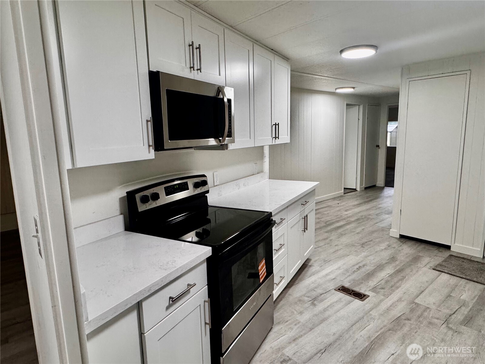 18425 Northeast 95th Street, Unit 76 Redmond, WA 98052 - Photo 10 of 20 a kitchen with a sink and steel appliances