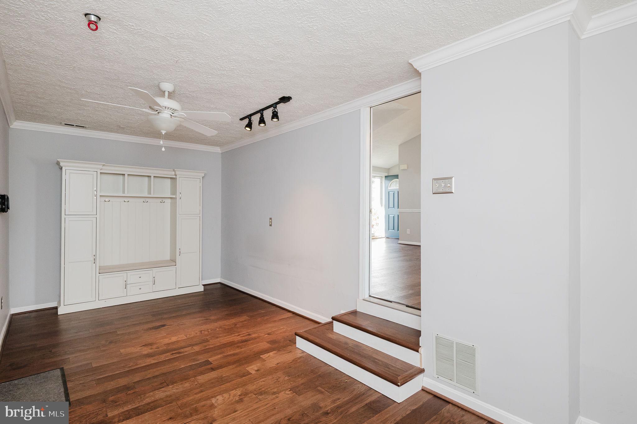 2601 Merrick Way Abingdon, MD 21009 - Photo 17 of 59 a view of an empty room with wooden floor and a ceiling fan
