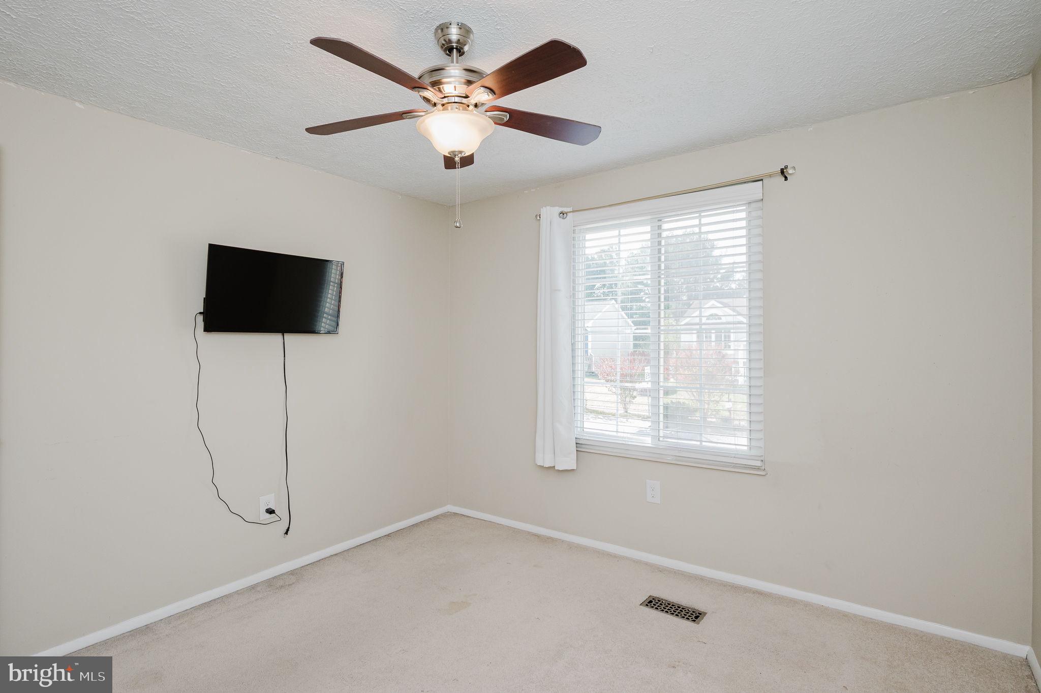 2601 Merrick Way Abingdon, MD 21009 - Photo 28 of 59 a view of a livingroom with a ceiling fan and a window