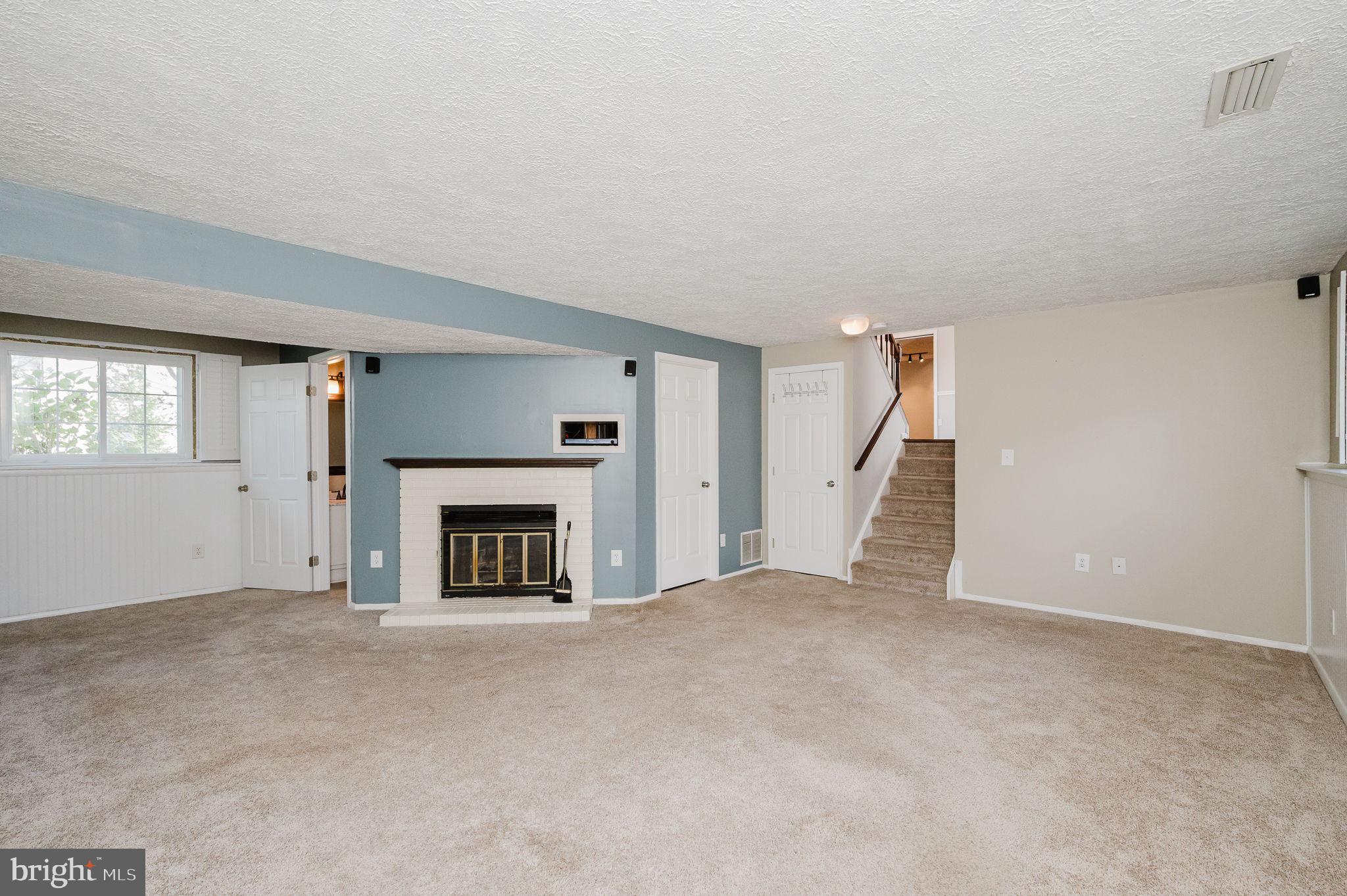 2601 Merrick Way Abingdon, MD 21009 - Photo 38 of 59 a view of a livingroom with a fireplace and window