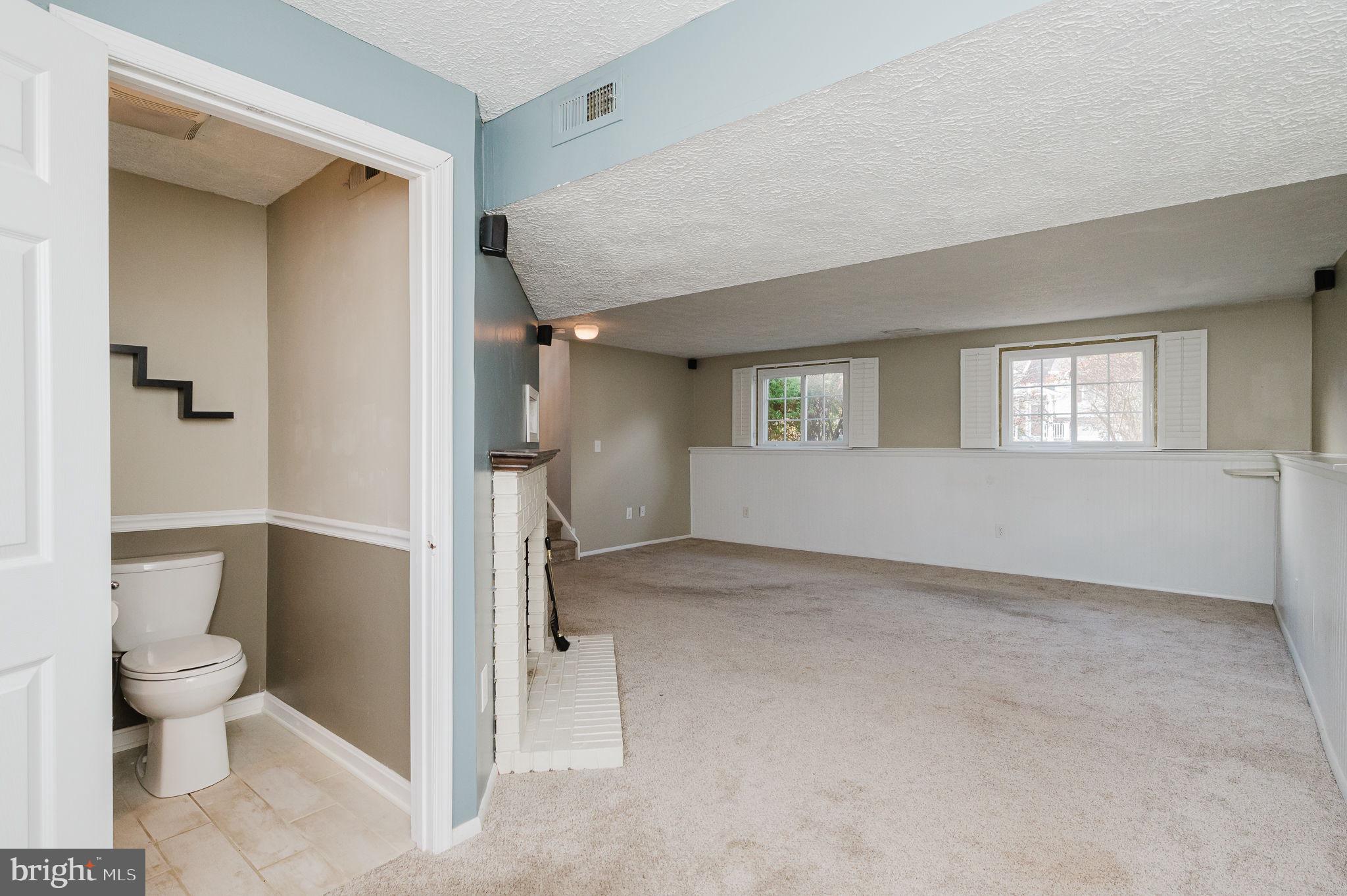 2601 Merrick Way Abingdon, MD 21009 - Photo 42 of 59 a view of an empty room with a fireplace and a window