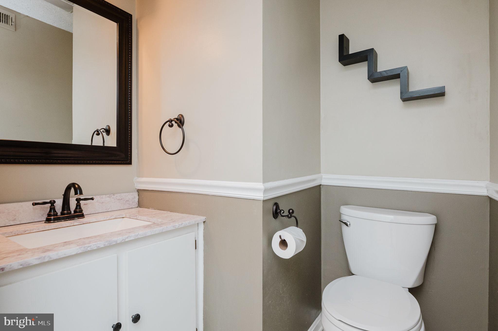 2601 Merrick Way Abingdon, MD 21009 - Photo 43 of 59 a bathroom with a toilet sink and mirror