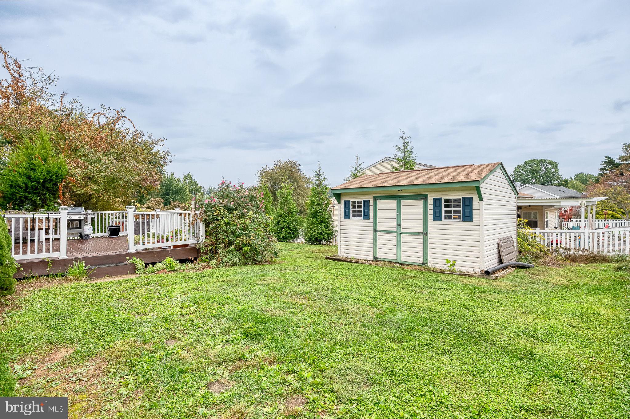 2601 Merrick Way Abingdon, MD 21009 - Photo 45 of 59 a front view of a house with a garden and yard