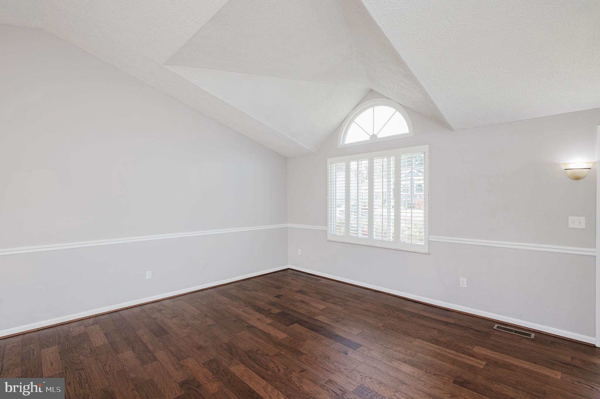 2601 Merrick Way Abingdon, MD 21009 - Photo 6 of 59 an empty room with wooden floor and windows