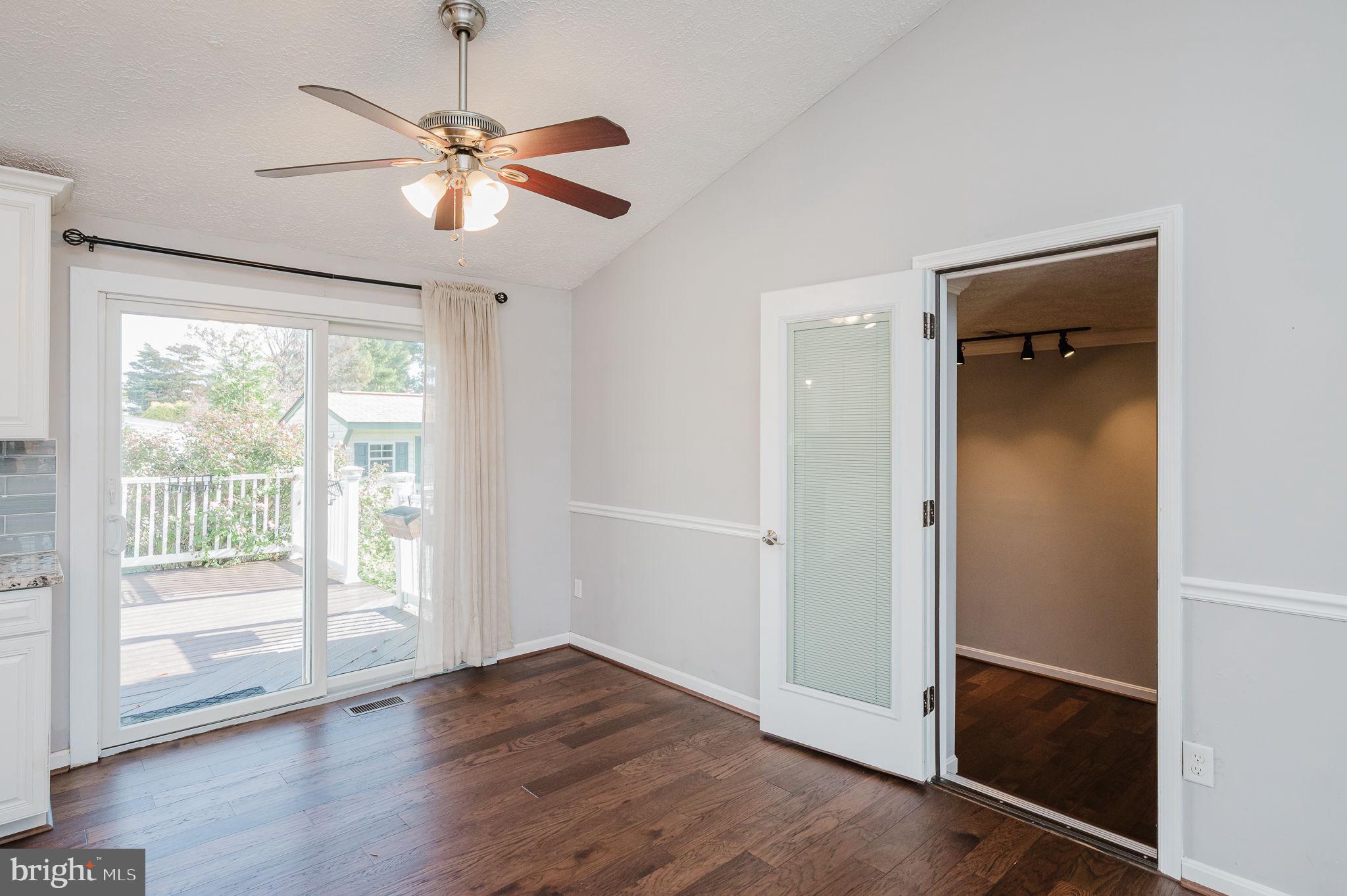 2601 Merrick Way Abingdon, MD 21009 - Photo 8 of 59 an empty room with wooden floor fan and windows