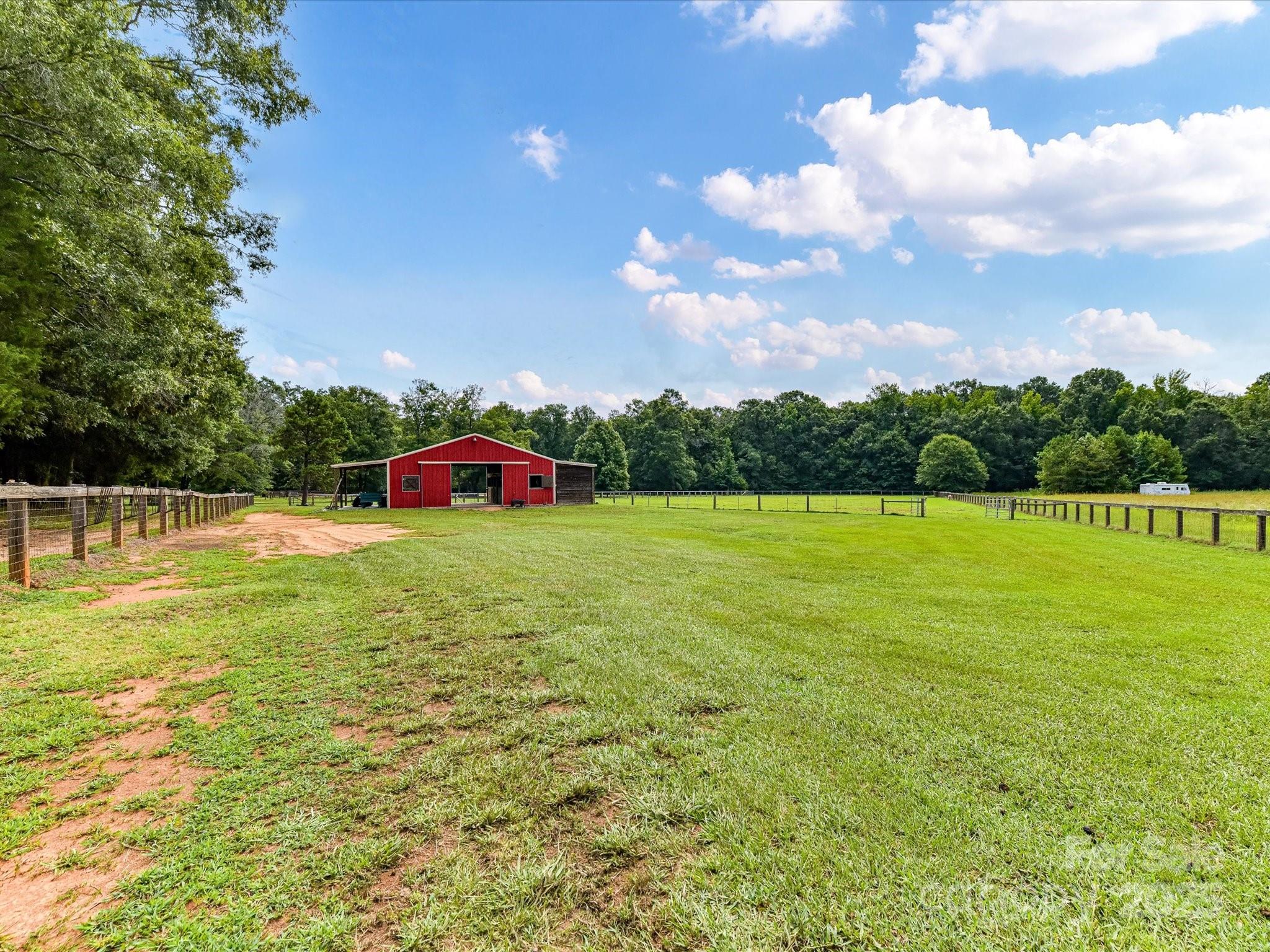 0 Maggie Robinson Road Waxhaw, NC 28173 - Photo 18 of 42 a front view of a house with garden