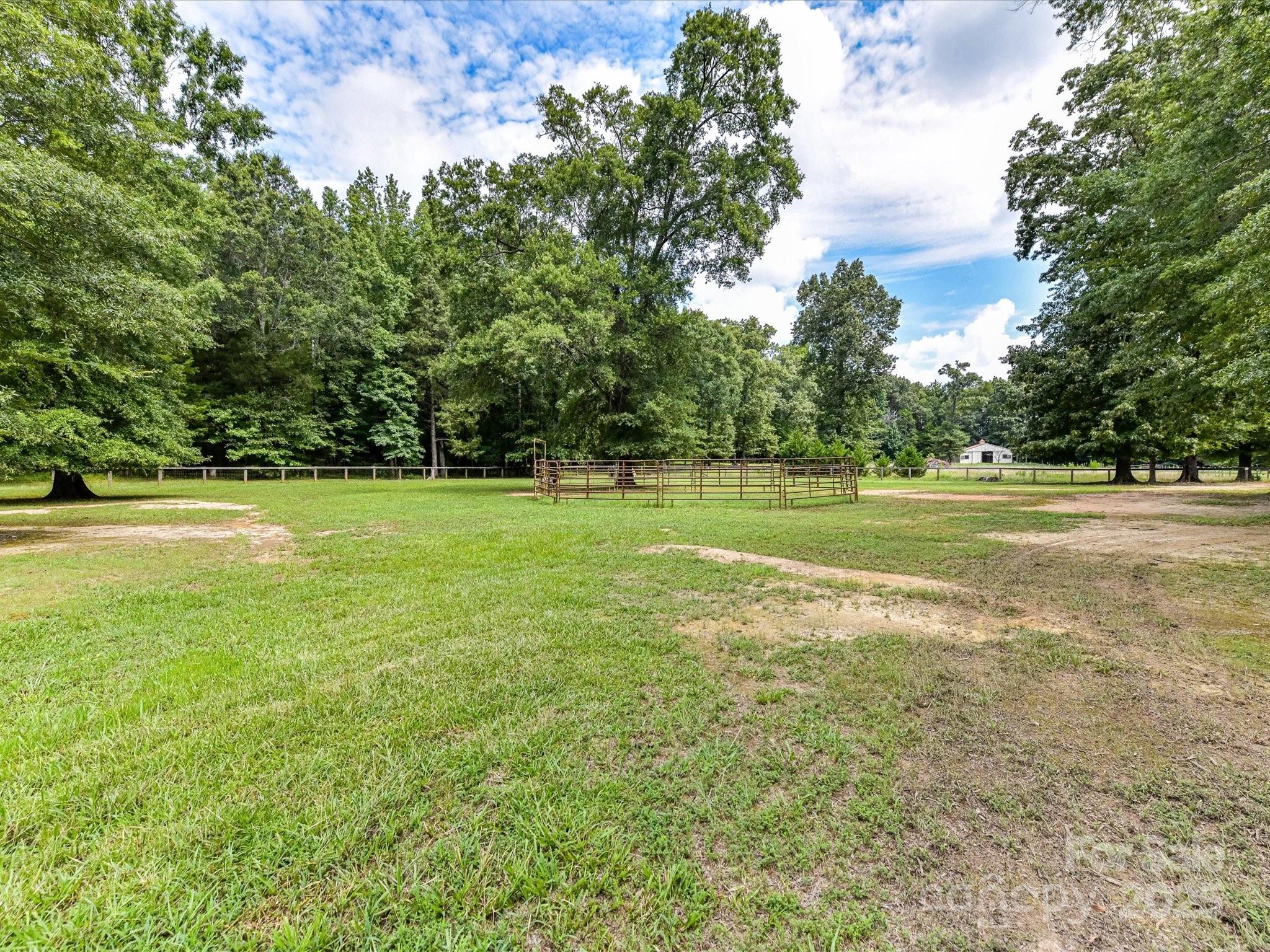 0 Maggie Robinson Road Waxhaw, NC 28173 - Photo 19 of 42 a view of a big yard with swimming pool and green space