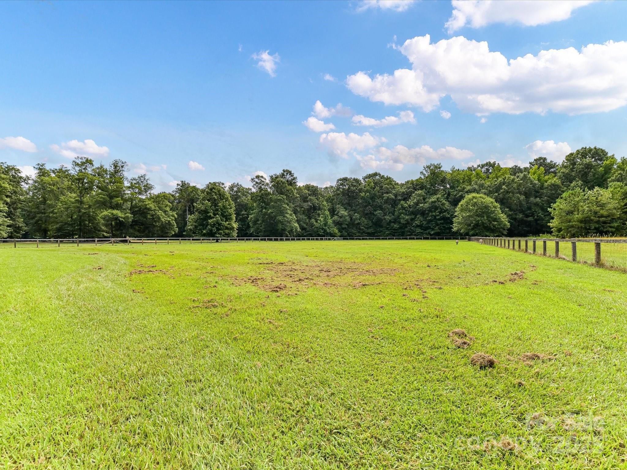 0 Maggie Robinson Road Waxhaw, NC 28173 - Photo 21 of 42 a view of yard with swimming pool and trees in the background