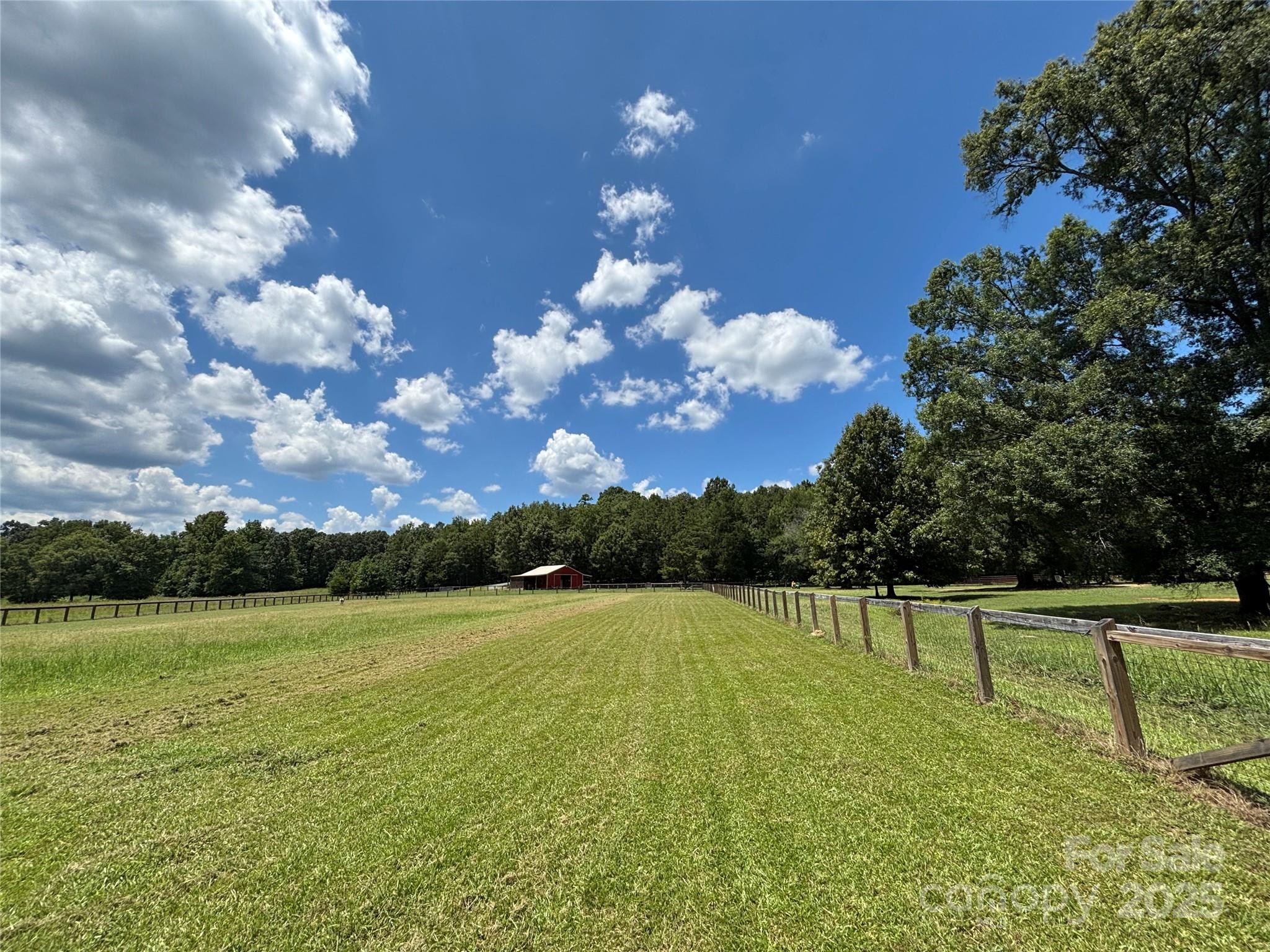 0 Maggie Robinson Road Waxhaw, NC 28173 - Photo 5 of 42 a view of a golf course with a lake
