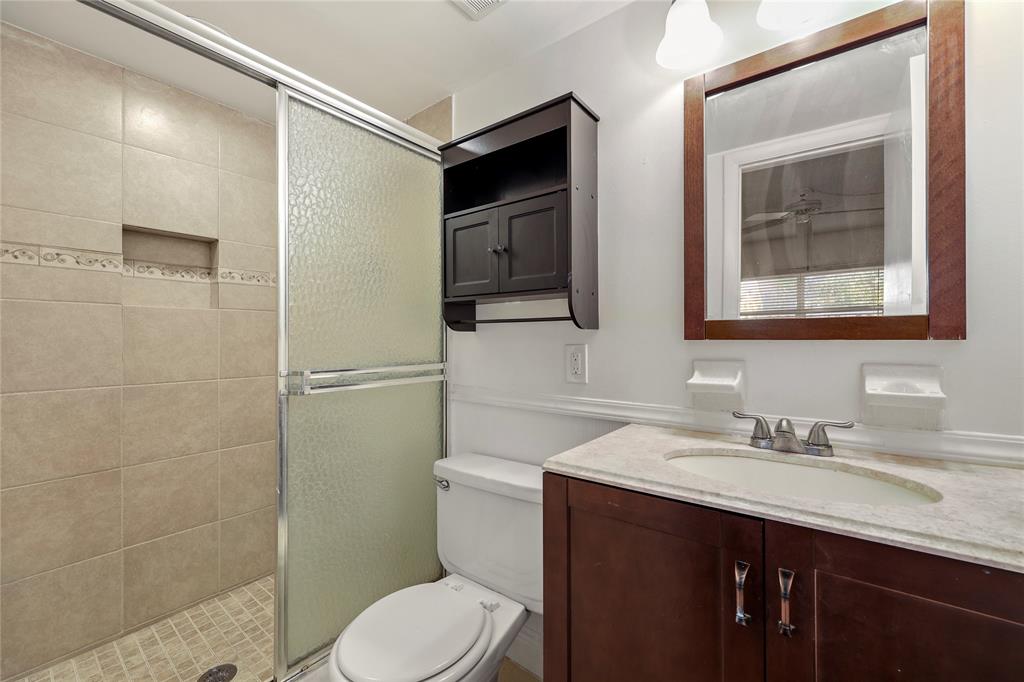 280 South Cypress Road, Unit 306 Pompano Beach, FL 33060 - Photo 13 of 17 a bathroom with a sink toilet and shower