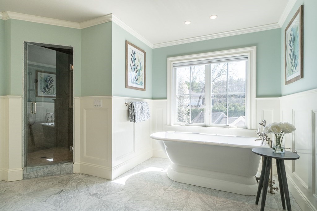 99 Country Way Needham, MA 02492 - Photo 23 of 42 a white bath tub sitting in a bathroom next to a window