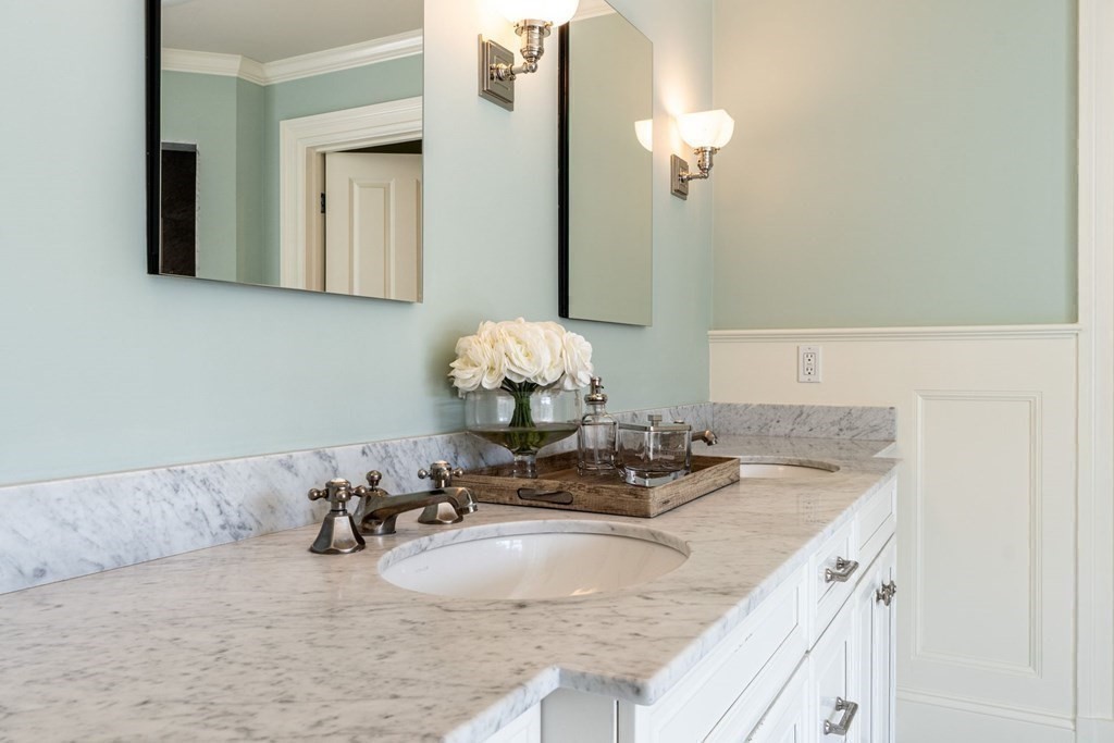 99 Country Way Needham, MA 02492 - Photo 24 of 42 a bathroom with a granite countertop sink and a mirror