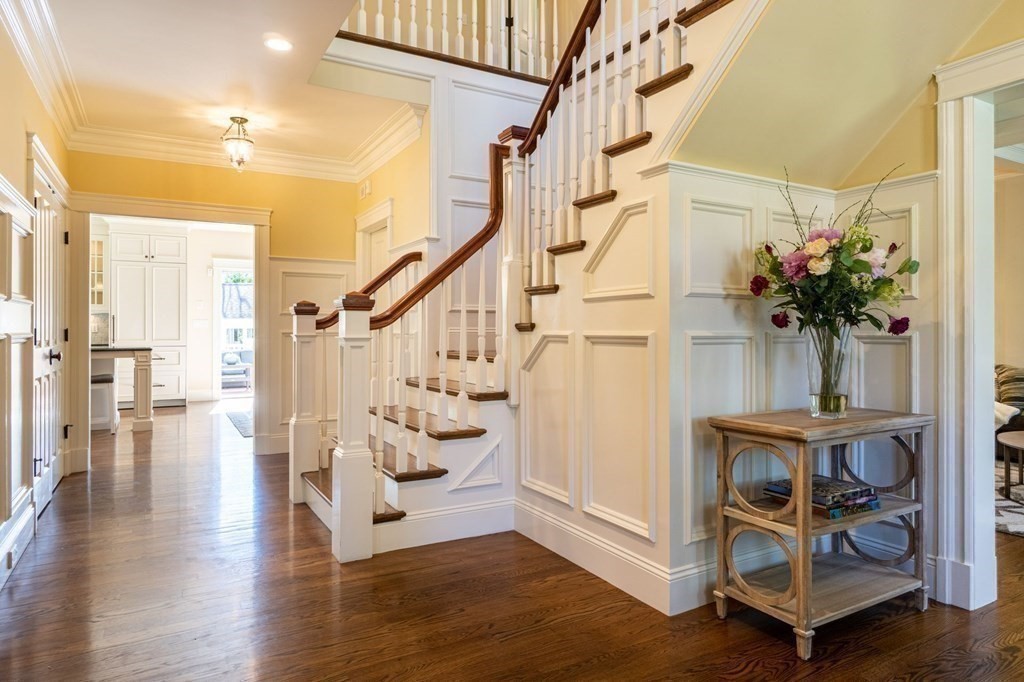 99 Country Way Needham, MA 02492 - Photo 6 of 42 a view of an entryway with wooden floor and a potted plant