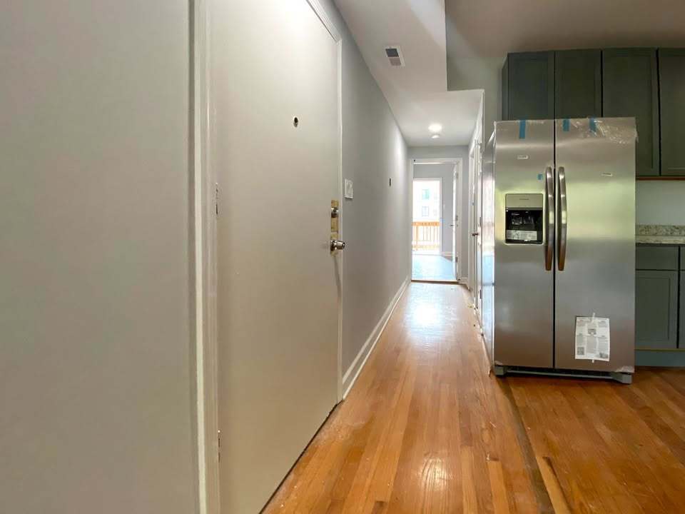 619 East Groveland Park, Unit 2W Chicago, IL 60616 - Photo 8 of 17 a view of a hallway with wooden floor