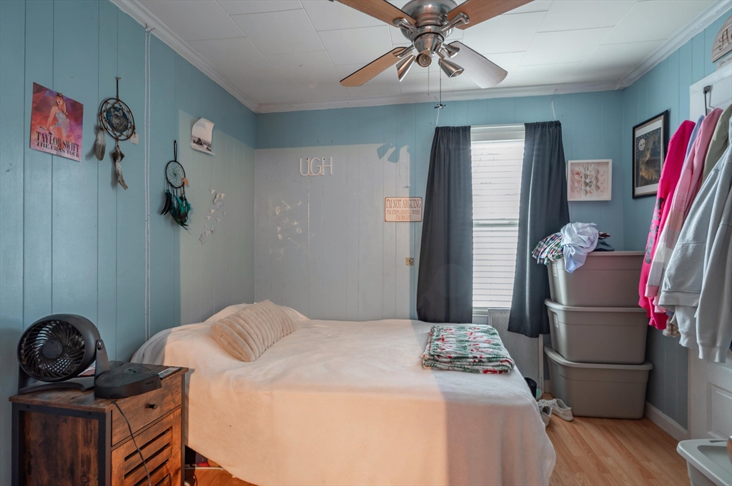 7 Field Avenue Methuen, MA 01844 - Photo 19 of 24 a bedroom with a bed and wooden floor
