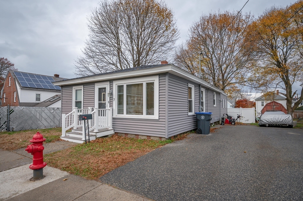 7 Field Avenue Methuen, MA 01844 - Photo 3 of 24 a view of a house with a yard and large tree