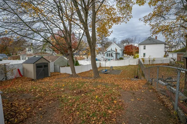 a view of a house with a yard covered in snow