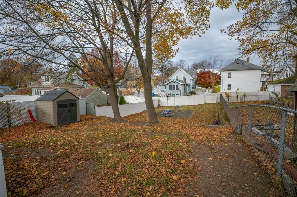 7 Field Avenue Methuen, MA 01844 - Photo 5 of 24 a view of a house with a yard covered in snow
