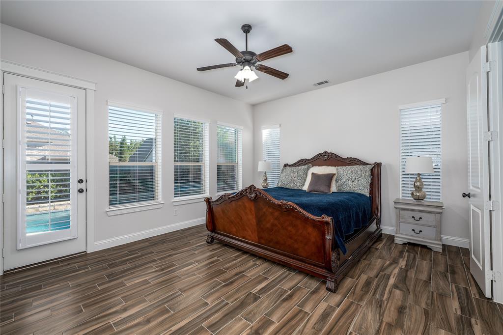 309 Bachman Creek Drive McKinney, TX 75072 - Photo 13 of 37 a bedroom with a bed and window