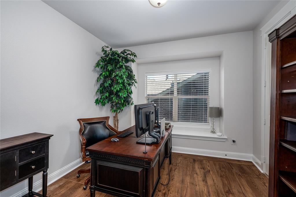 309 Bachman Creek Drive McKinney, TX 75072 - Photo 17 of 37 a view of a workspace with furniture and a window