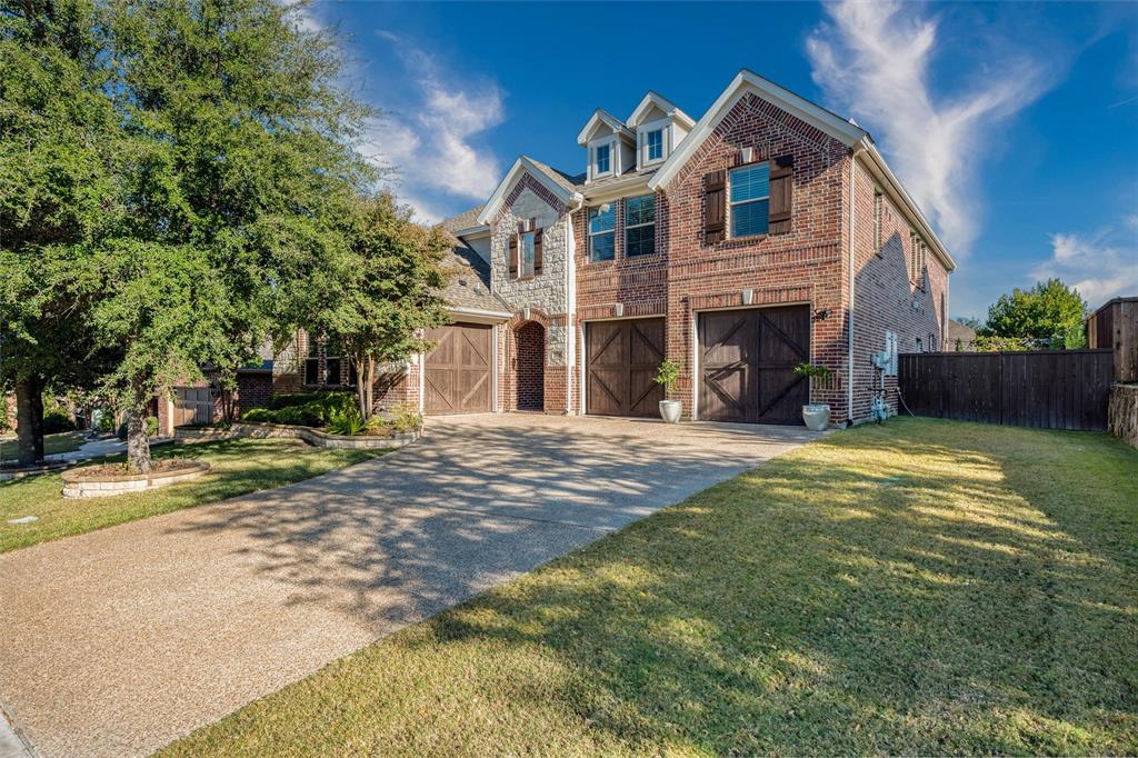 309 Bachman Creek Drive McKinney, TX 75072 - Photo 2 of 37 a view of a house with a yard and large tree