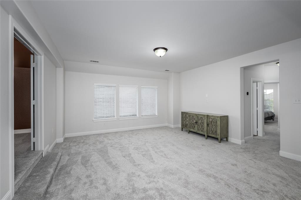 309 Bachman Creek Drive McKinney, TX 75072 - Photo 23 of 37 a view of an empty room with window and bathroom