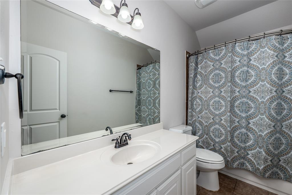 309 Bachman Creek Drive McKinney, TX 75072 - Photo 26 of 37 a bathroom with a sink toilet and shower