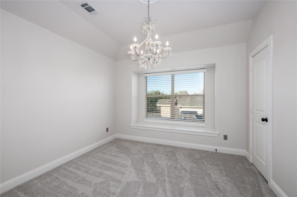 309 Bachman Creek Drive McKinney, TX 75072 - Photo 28 of 37 a view of an empty room with a window