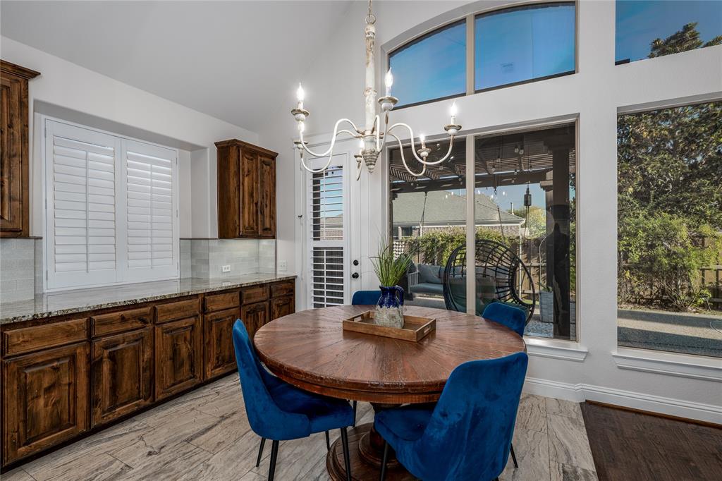 309 Bachman Creek Drive McKinney, TX 75072 - Photo 9 of 37 a view of a kitchen area with furniture and window