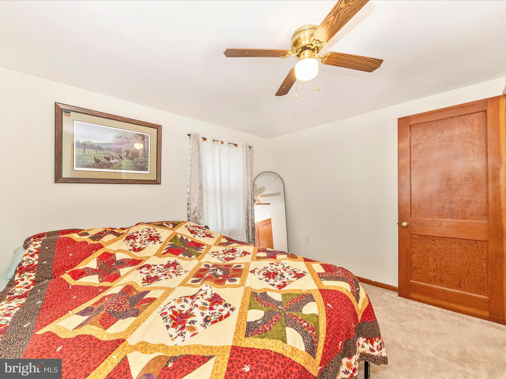 14021 Broadfording Church Road Hagerstown, MD 21740 - Photo 14 of 46 a bedroom with a bed and a painting on the wall