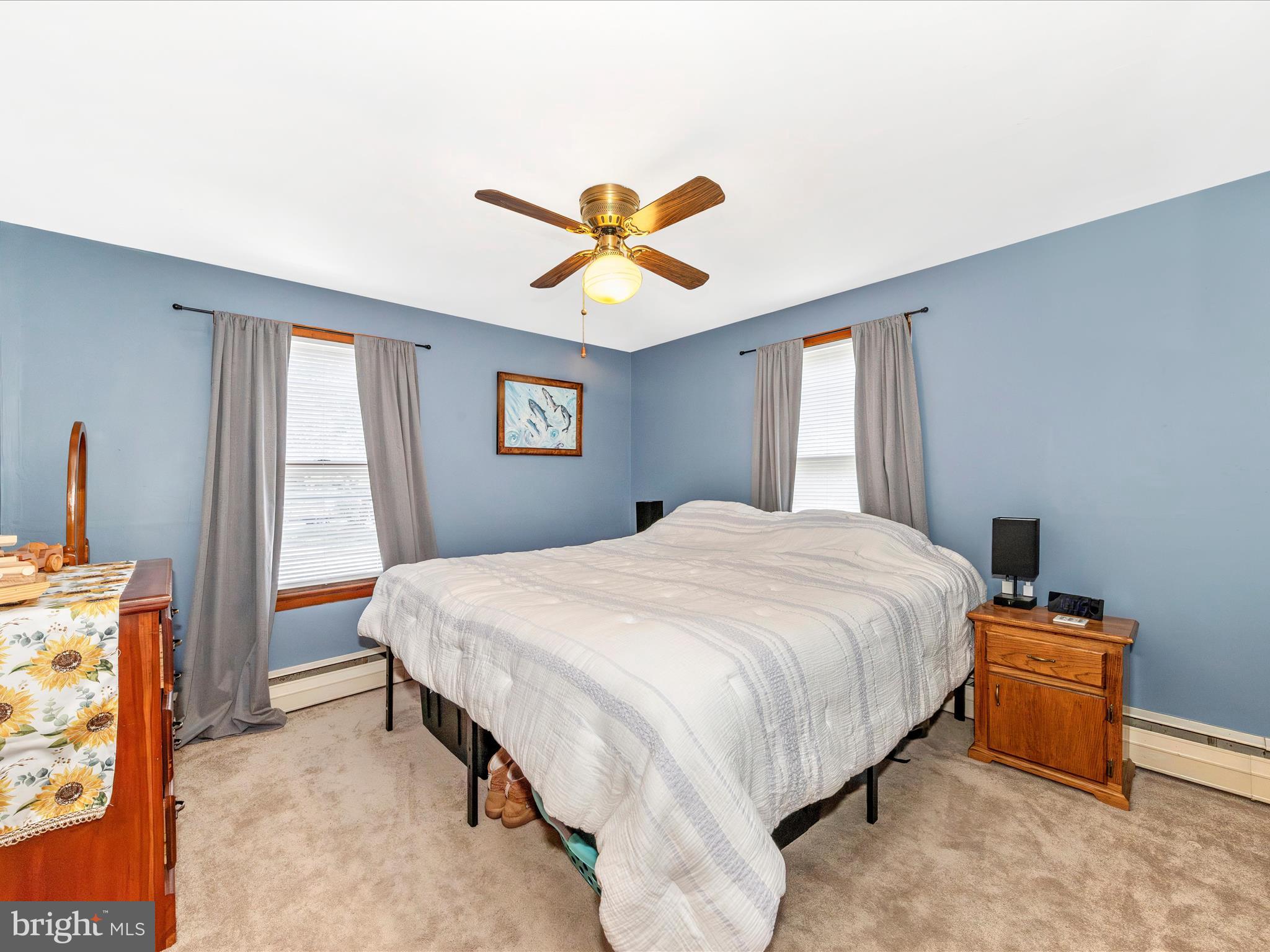 14021 Broadfording Church Road Hagerstown, MD 21740 - Photo 16 of 46 a bedroom with a bed and a chandelier
