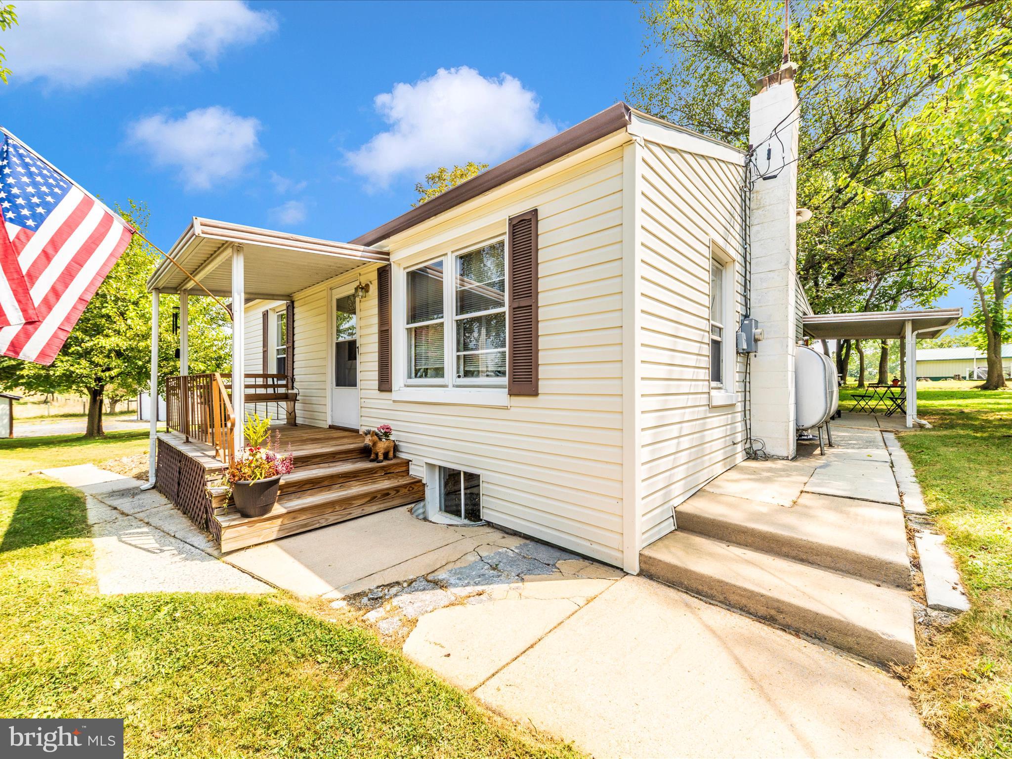 14021 Broadfording Church Road Hagerstown, MD 21740 - Photo 33 of 46 a front view of a house with a patio