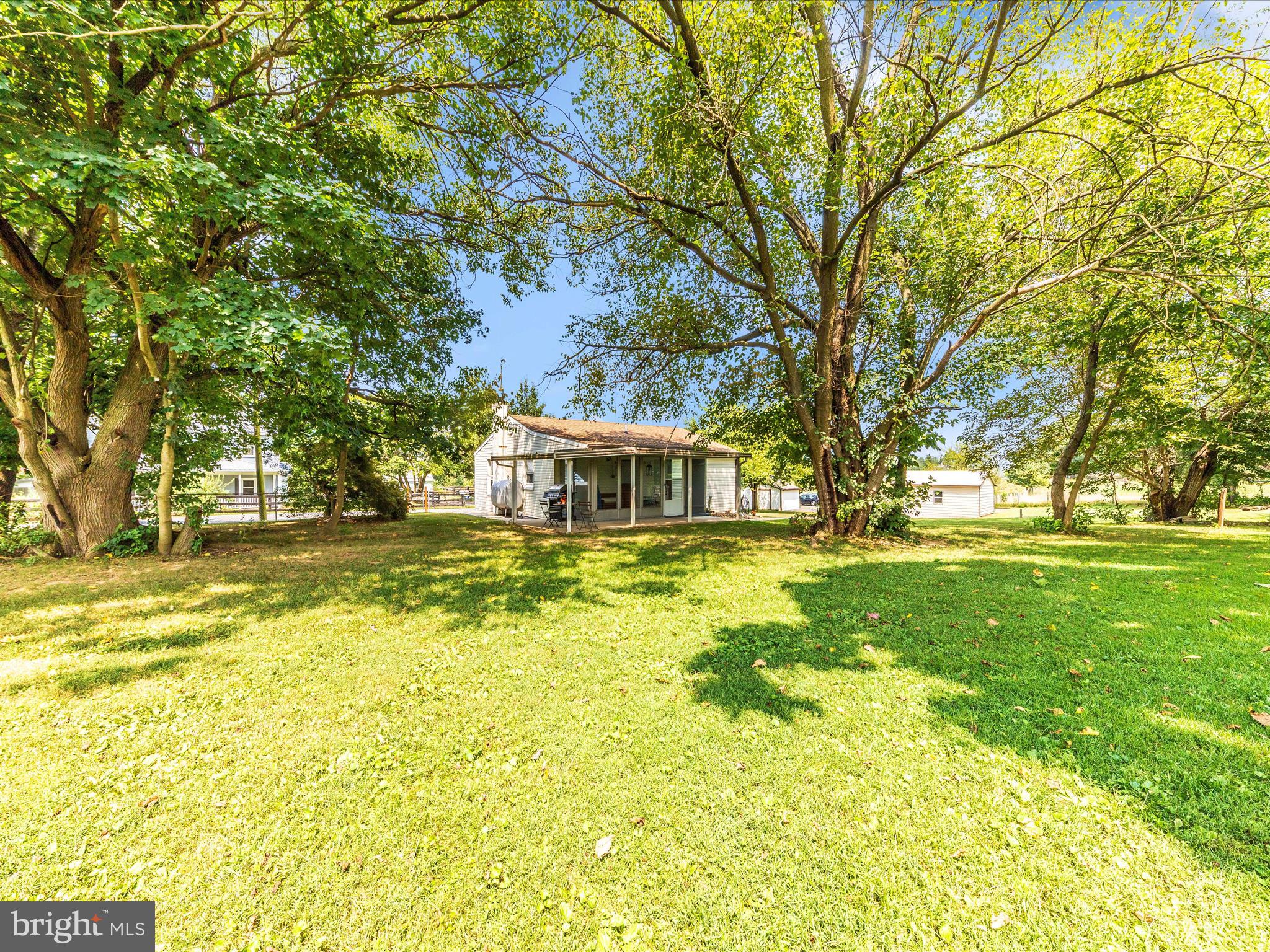 14021 Broadfording Church Road Hagerstown, MD 21740 - Photo 36 of 46 a front view of a house with a big yard