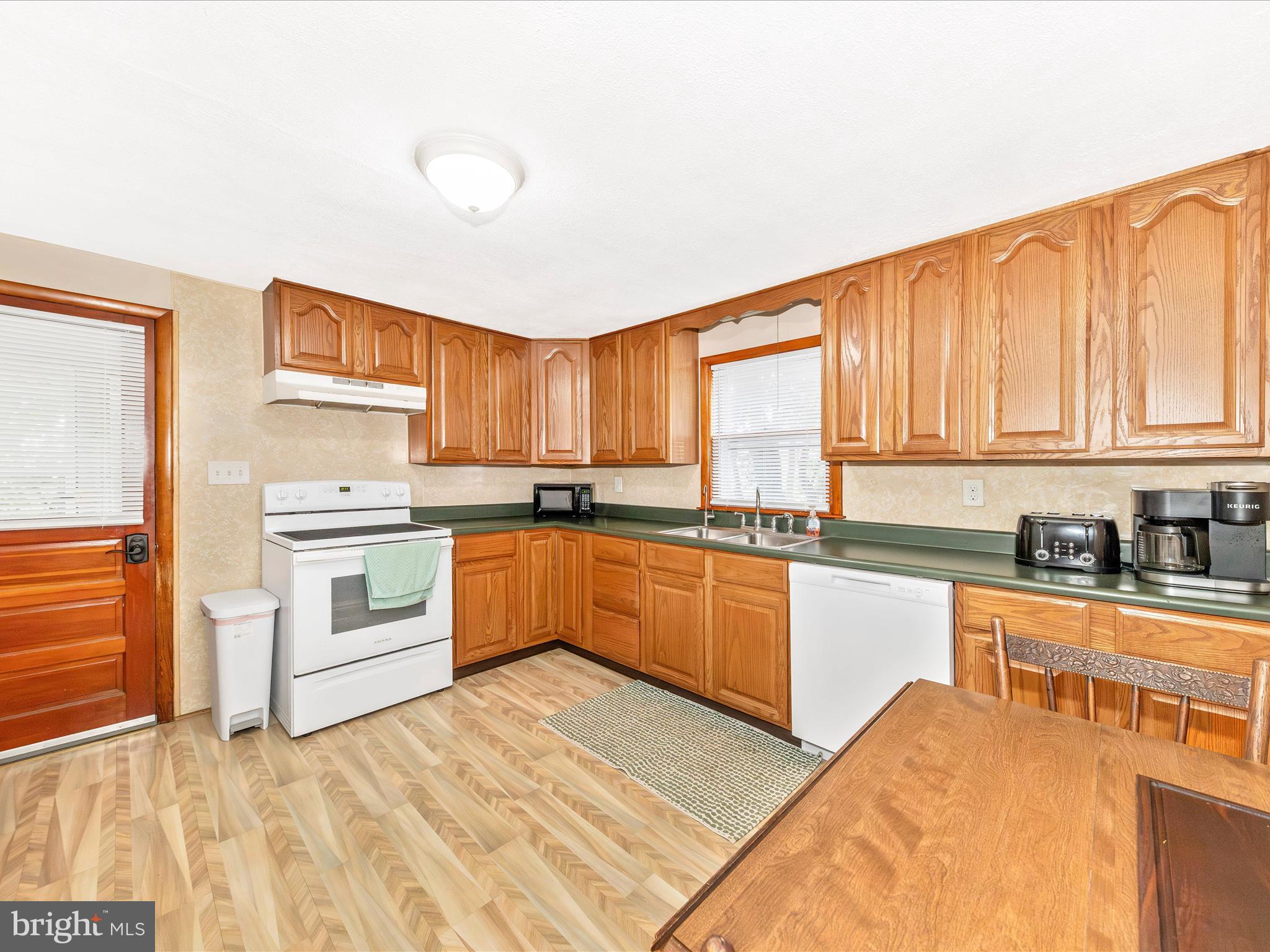 14021 Broadfording Church Road Hagerstown, MD 21740 - Photo 9 of 46 a kitchen with stainless steel appliances granite countertop a stove a sink dishwasher and a refrigerator