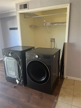 a utility room with dryer and washer