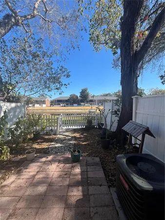 a view of a backyard with sitting area