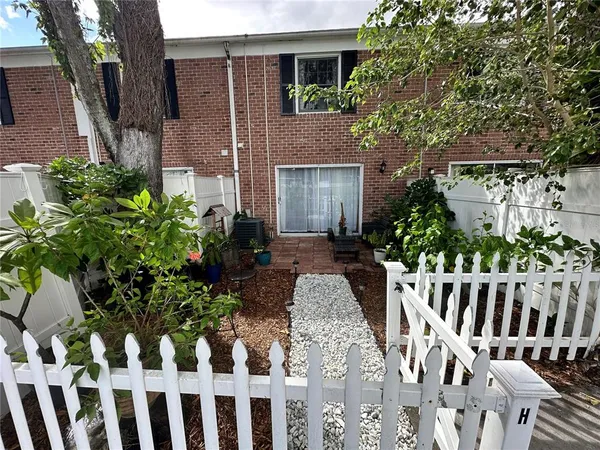 a front view of house with patio entertaining space
