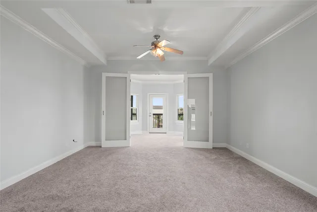 a view of empty room with ceiling fan