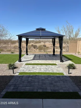 a view of a swimming pool with an outdoor seating area