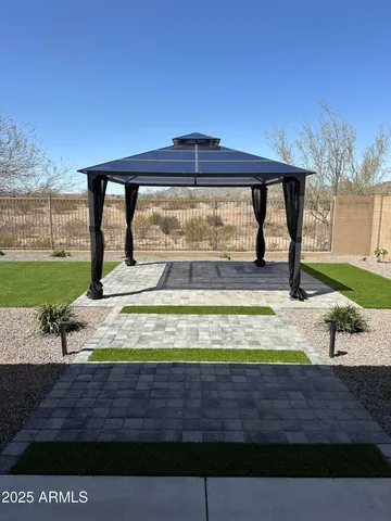 a view of a swimming pool with an outdoor seating area