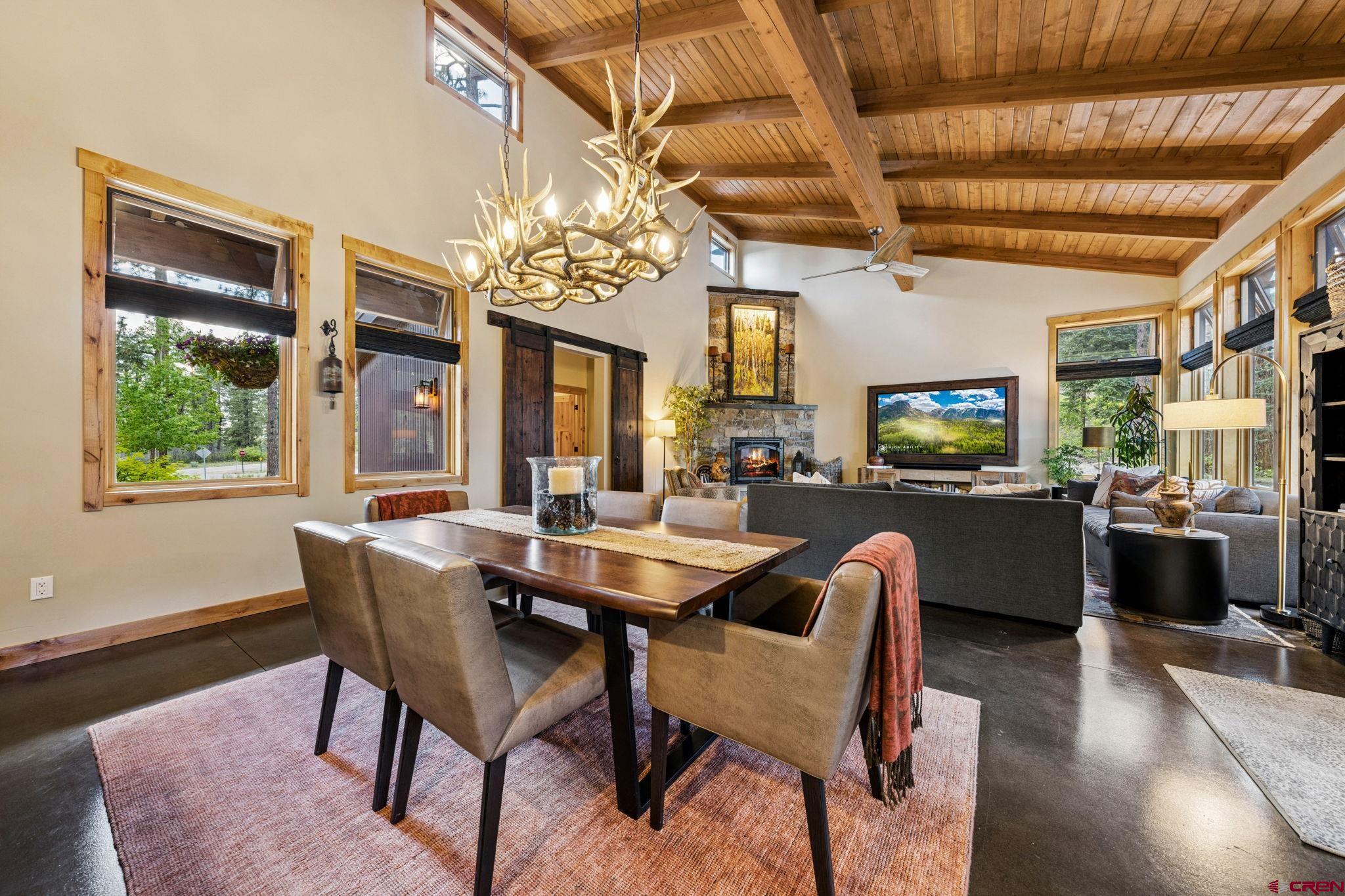 24 Monarch Crest Trail Durango, CO 81301 - Photo 9 of 45 a dining room with furniture a chandelier and wooden floor
