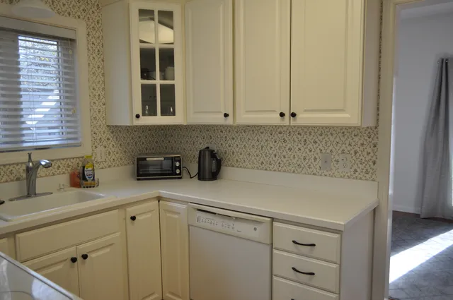 a kitchen with a sink and a window