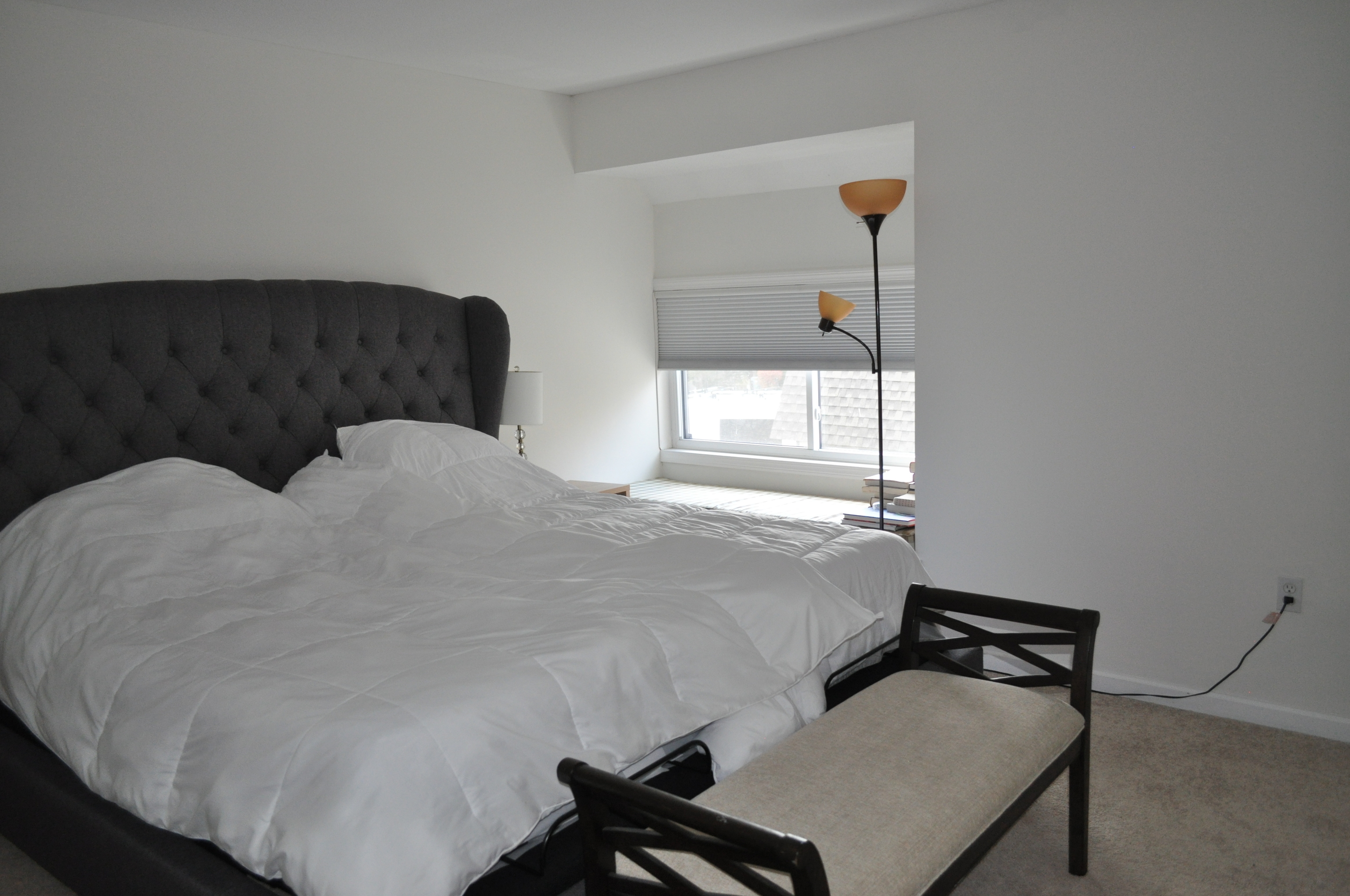 29 Crocus Lane, Unit 29 Avon, CT 06001 - Photo 9 of 13 a bedroom with a bed and window