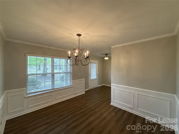 a kitchen with wooden cabinets and stainless steel appliances