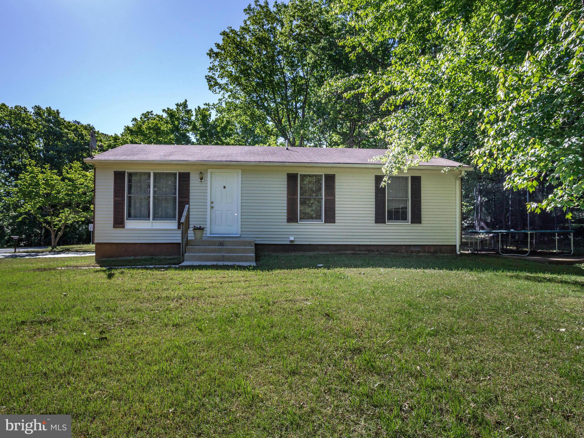 12708 Olivet Road Lusby, MD 20657 - Photo 1 of 22 front view of a house with a yard