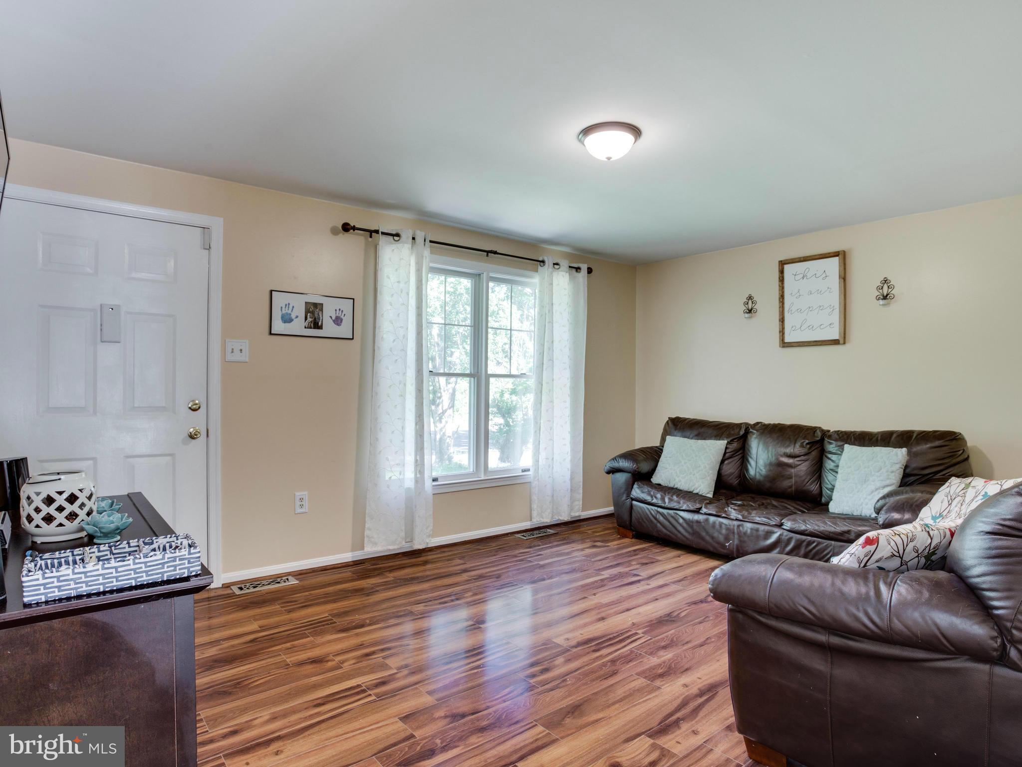 12708 Olivet Road Lusby, MD 20657 - Photo 15 of 22 a living room with furniture and a window